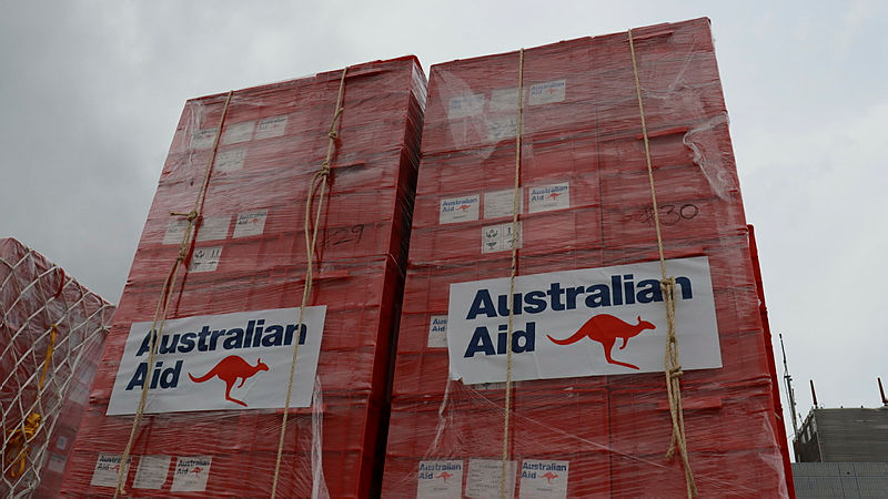 Shipping containters labelled "Australian Aid"
