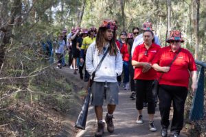 A group of people walking through Toohey Forest during the 2021 Walk and Talk event. 