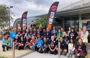 Sameer, the organising group, and school teachers pose for a photo outside the conference venue.